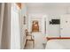 Bright bedroom featuring neutral colors and a quaint seating area, creating a serene and inviting space at 3328 Bryant St, Denver, CO 80211