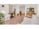 Spacious living room featuring hardwood floors, bright windows, and white furniture and a patterned rug at 3328 Bryant St, Denver, CO 80211