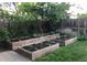 Landscaped backyard with raised garden beds at 7024 E Montana Pl, Denver, CO 80224