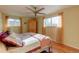 Bedroom with hardwood floors and a ceiling fan at 7024 E Montana Pl, Denver, CO 80224