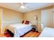 Bright bedroom with hardwood floors and ceiling fan at 7024 E Montana Pl, Denver, CO 80224