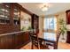 Kitchen dining area with built-in hutch and wood table at 7024 E Montana Pl, Denver, CO 80224