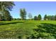 Large grassy park with mature trees and open space at 7024 E Montana Pl, Denver, CO 80224