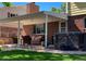 Spacious patio with hot tub and seating at 7024 E Montana Pl, Denver, CO 80224