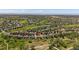 Expansive aerial view of a home in a community near a golf course and green spaces at 7912 S Buchanan Way, Aurora, CO 80016
