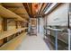 Unfinished basement area with shelving and work bench, perfect for storage or hobbies at 7912 S Buchanan Way, Aurora, CO 80016