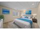 Calm bedroom featuring a plush bed, soft lighting, and modern decor at 7912 S Buchanan Way, Aurora, CO 80016