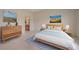 Serene bedroom featuring neutral decor, a comfortable bed, and coordinated furnishings at 7912 S Buchanan Way, Aurora, CO 80016