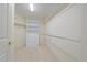 Well-organized closet with shelving and rods provides ample storage space for clothing and accessories at 7912 S Buchanan Way, Aurora, CO 80016