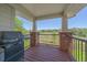 Outdoor deck with built-in grill and scenic views offers the perfect spot for al fresco dining and relaxation at 7912 S Buchanan Way, Aurora, CO 80016