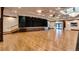 Large event space featuring a stage, hardwood flooring, and ample space for gatherings at 7912 S Buchanan Way, Aurora, CO 80016