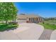 Charming single-story home with manicured lawn, mature tree, and a curved driveway at 7912 S Buchanan Way, Aurora, CO 80016