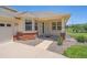 Inviting front porch with brick accents and well-maintained landscaping at 7912 S Buchanan Way, Aurora, CO 80016