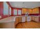 Well-lit kitchen with light wood cabinets, countertops, and white appliances at 7912 S Buchanan Way, Aurora, CO 80016