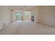 Bright living room featuring fireplace, ceiling fan, and access to a balcony at 7912 S Buchanan Way, Aurora, CO 80016