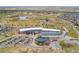 Aerial view of a commercial building with ample parking and landscaping at 19047 Randolph Pl, Denver, CO 80249