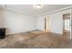 Spacious bedroom with neutral walls, carpet, ceiling detail, and doorways to the bathroom and hallway at 19047 Randolph Pl, Denver, CO 80249
