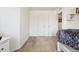 Bright bedroom featuring white walls, carpet, and a twin bed with a blue patterned comforter at 19047 Randolph Pl, Denver, CO 80249