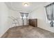 This bedroom features neutral carpeting, and a chest of drawers for storage at 19047 Randolph Pl, Denver, CO 80249
