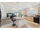 Open kitchen with a granite island and a view to the cozy living area at 19047 Randolph Pl, Denver, CO 80249