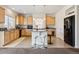 Kitchen with granite countertops, bar seating, and stainless steel appliances at 19047 Randolph Pl, Denver, CO 80249