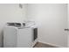 A well-maintained laundry room featuring modern, front-load washer and dryer at 19047 Randolph Pl, Denver, CO 80249