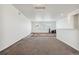 An airy living room featuring neutral walls and carpeting at 19047 Randolph Pl, Denver, CO 80249