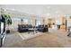 Inviting living room with an open layout to the kitchen and sliding glass doors at 19047 Randolph Pl, Denver, CO 80249