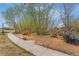 A spacious playground is surrounded by mature trees at 19047 Randolph Pl, Denver, CO 80249