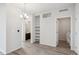 Hallway with access to bathroom on the left, laundry on the right and a storage unit in the middle at 487 Interlocken Blvd # 303, Broomfield, CO 80021