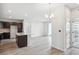 Open-concept living space with a kitchen island, seamlessly connected to the living and dining area at 487 Interlocken Blvd # 303, Broomfield, CO 80021