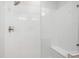 Sleek, glass-enclosed shower with chrome fixtures and a built-in bench at 487 Interlocken Blvd # 303, Broomfield, CO 80021