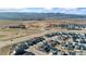 Panoramic aerial view highlighting homes with solar panels, offering a sustainable living environment with scenic surroundings at 8480 Arriba Dr, Littleton, CO 80125