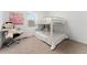 Comfortable bedroom with a bunk bed and a decorative teddy bear at 8480 Arriba Dr, Littleton, CO 80125