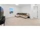 Cozy bedroom featuring a comfortable sectional sofa and plush carpeting for a relaxing space at 8480 Arriba Dr, Littleton, CO 80125