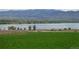 Scenic view of the community near a lake with lush green landscapes at 8480 Arriba Dr, Littleton, CO 80125