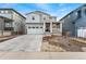 Charming two-story home with a well-manicured lawn and a two-car garage in a Gathering-friendly neighborhood at 8480 Arriba Dr, Littleton, CO 80125
