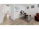 Well-lit office space featuring modern desk setup and a comfortable chair at 8480 Arriba Dr, Littleton, CO 80125