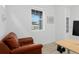 Bright office featuring large window, comfortable chair, and desk with modern equipment at 8480 Arriba Dr, Littleton, CO 80125