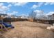 Fenced backyard with playset and trampoline at 11455 River Run Pkwy, Commerce City, CO 80640