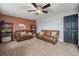 Living room with two leather couches and an accent wall at 11455 River Run Pkwy, Commerce City, CO 80640