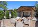 Backyard with firepit and pergola featuring comfortable seating area at 9400 Ridge Rd, Arvada, CO 80002