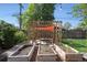Relaxing backyard featuring a pergola, a shade screen, and charming garden boxes at 9400 Ridge Rd, Arvada, CO 80002