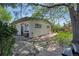 Well-maintained home exterior featuring landscaped backyard, with pergola, stone and wood features at 9400 Ridge Rd, Arvada, CO 80002