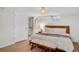 Cozy bedroom with hardwood floors, a small window, a comfortable bed, and a simple decor at 9400 Ridge Rd, Arvada, CO 80002