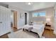 Inviting bedroom with neutral tones, wood floors, a window with natural light, and ample closet space at 9400 Ridge Rd, Arvada, CO 80002