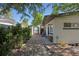 Charming home exterior featuring brick accents, tidy landscaping, and a convenient storage shed at 9400 Ridge Rd, Arvada, CO 80002