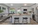 Bright kitchen with modern white cabinets, stainless steel appliances, and a cozy breakfast nook at 9400 Ridge Rd, Arvada, CO 80002