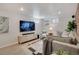 Cozy living room featuring a TV, comfortable seating, and accent lighting at 9400 Ridge Rd, Arvada, CO 80002