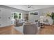 Cozy living room featuring stylish decor, neutral tones, and plenty of natural light from the large window at 9400 Ridge Rd, Arvada, CO 80002